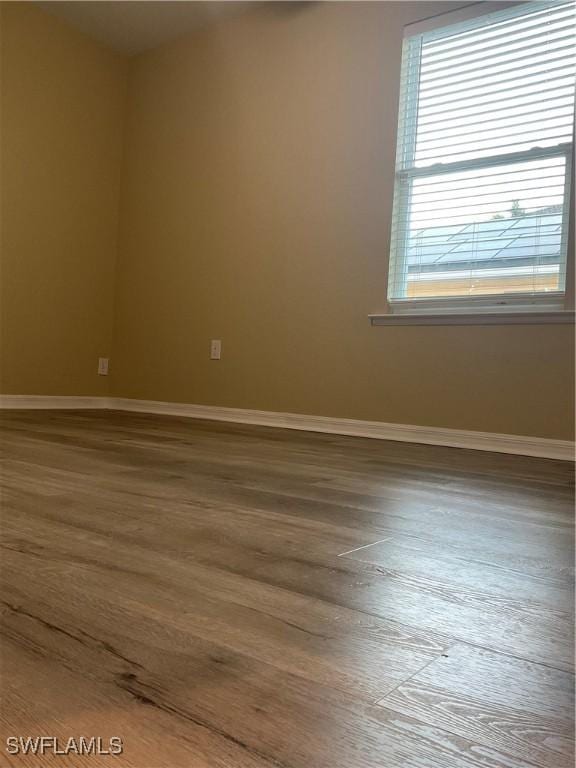 empty room with wood-type flooring