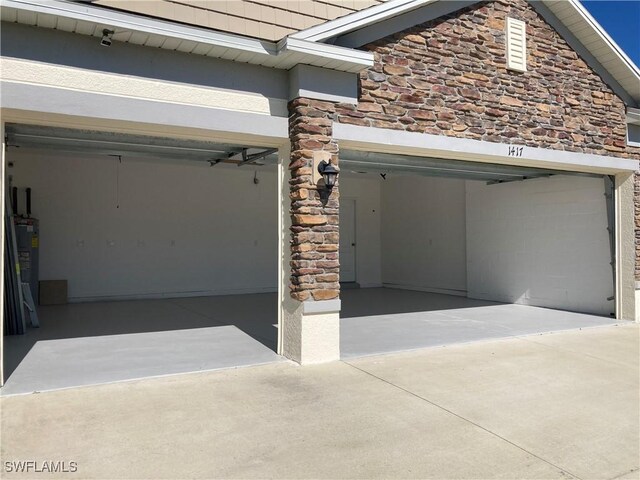 garage with electric water heater