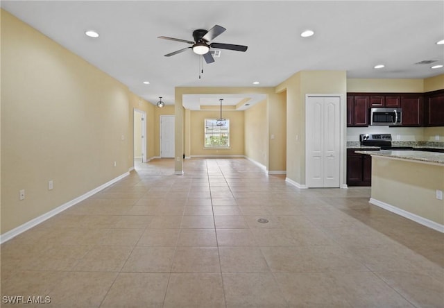 interior space with ceiling fan and light tile patterned floors