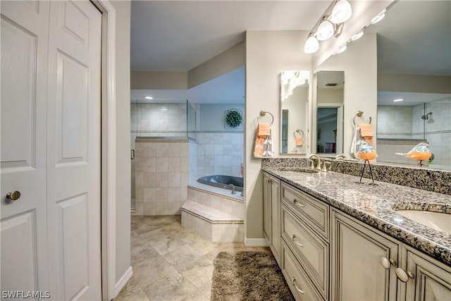 bathroom with plus walk in shower and vanity