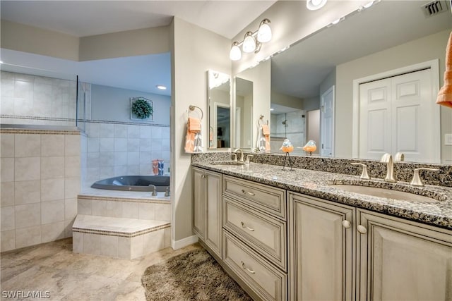 bathroom featuring separate shower and tub, tile patterned floors, and vanity