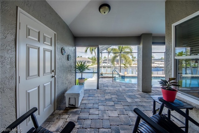 view of patio / terrace with a lanai