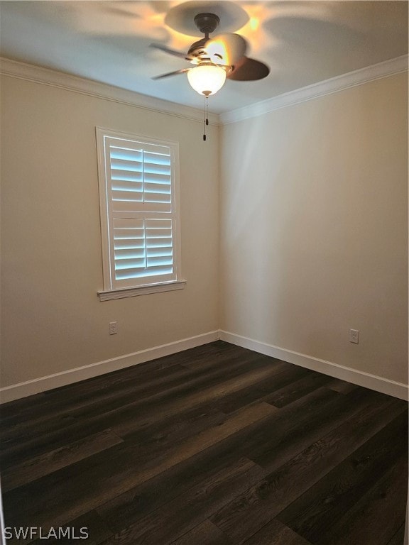 empty room with ceiling fan, dark hardwood / wood-style floors, and ornamental molding