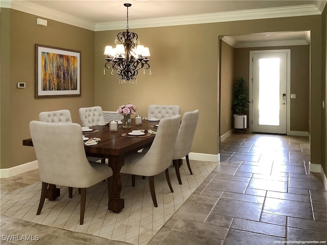 dining space with crown molding and an inviting chandelier