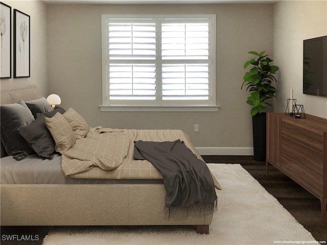 bedroom featuring dark hardwood / wood-style floors