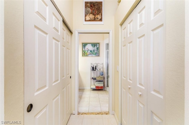 corridor with light tile patterned floors