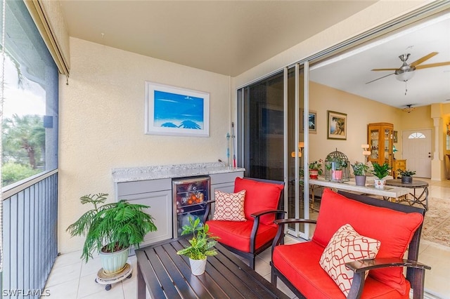 balcony with ceiling fan and beverage cooler