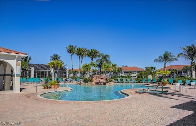 view of swimming pool with a patio