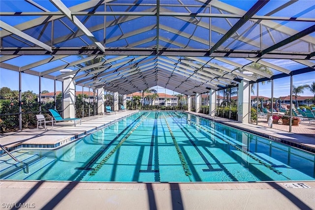 view of pool with a lanai and a patio area