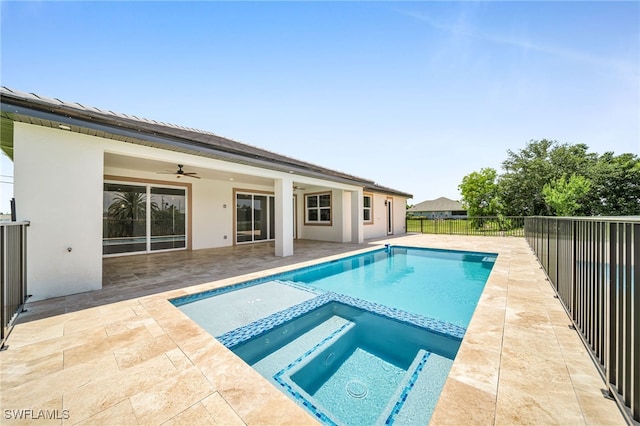 view of swimming pool with an in ground hot tub, a patio, and ceiling fan