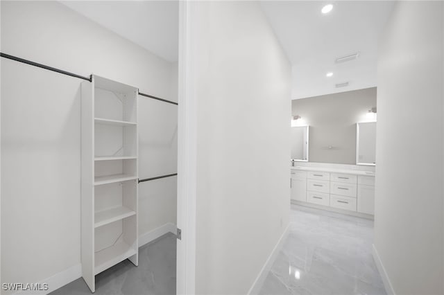 hallway featuring light tile patterned floors