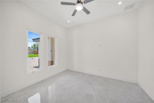 spare room with ceiling fan