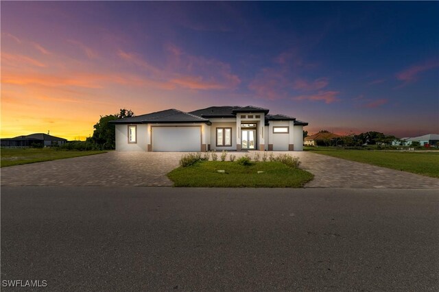 prairie-style home featuring a garage