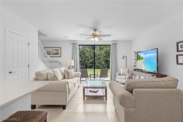 living room featuring ceiling fan and light tile patterned floors