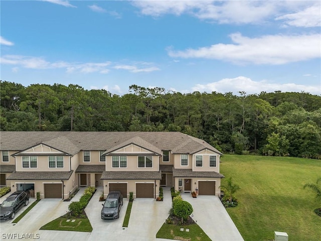 view of front of house featuring a front yard and a garage