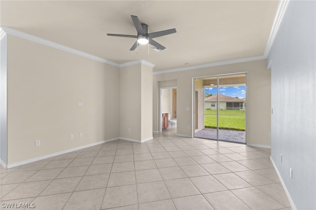 tiled spare room featuring crown molding and ceiling fan