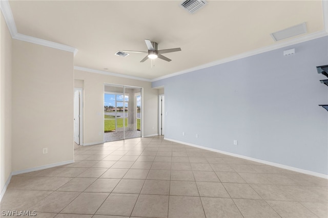 tiled empty room with ceiling fan and ornamental molding