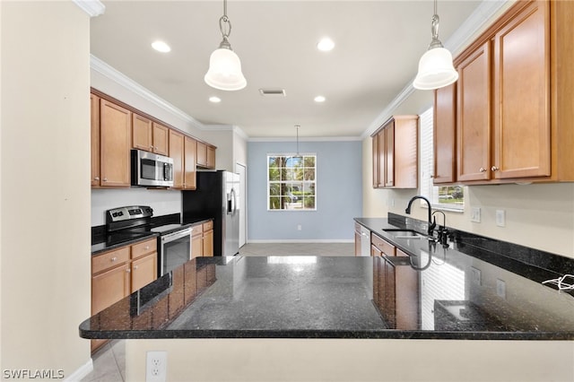 kitchen with stainless steel appliances, pendant lighting, crown molding, sink, and dark stone countertops