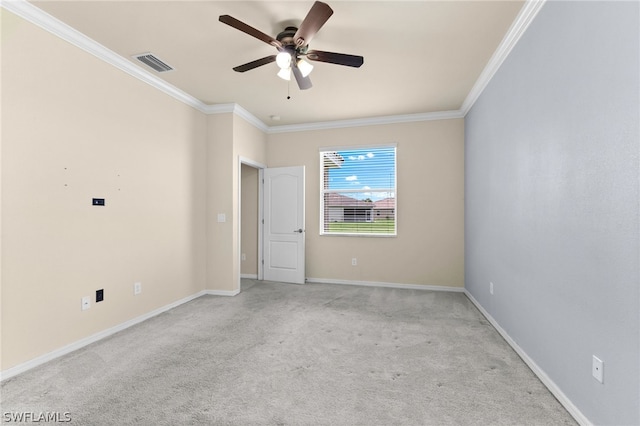 unfurnished room featuring carpet floors, crown molding, and ceiling fan