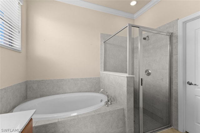 bathroom featuring vanity, shower with separate bathtub, and crown molding