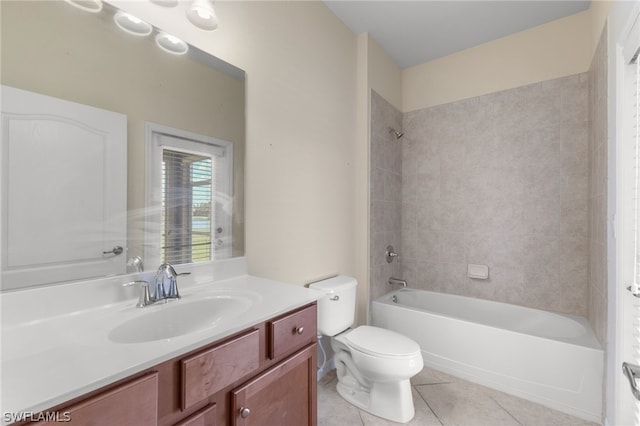 full bathroom featuring tiled shower / bath combo, vanity, tile patterned flooring, and toilet