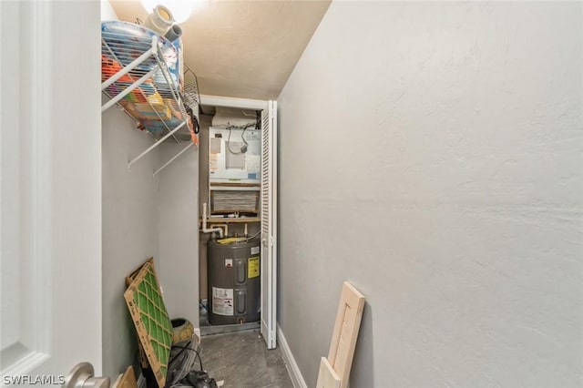 utility room featuring electric water heater