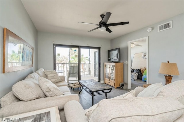 tiled living room with ceiling fan