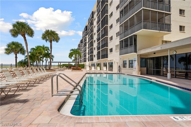 view of swimming pool featuring a patio