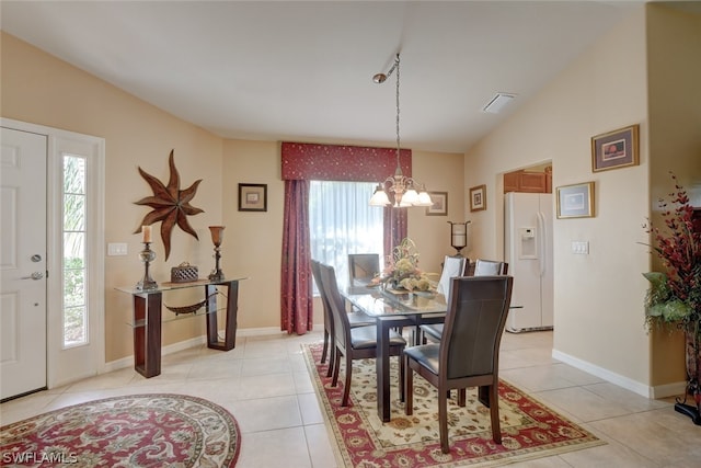 dining room featuring a chandelier, a wealth of natural light, and light tile patterned floors