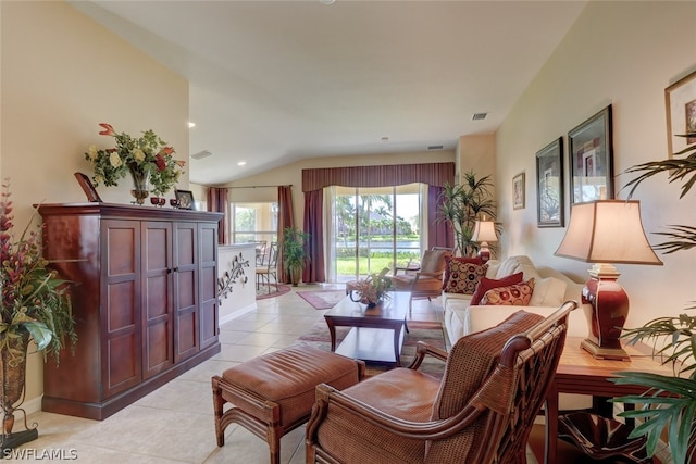 tiled living room with lofted ceiling