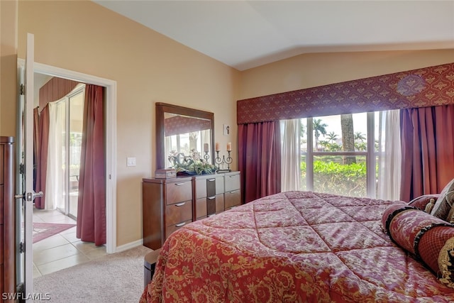 tiled bedroom featuring vaulted ceiling