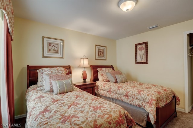 bedroom featuring dark carpet