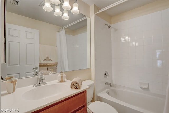 full bathroom with vanity, shower / bath combo, and toilet