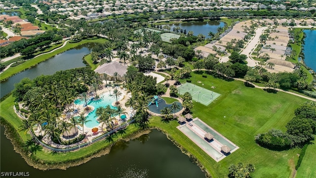 birds eye view of property with a water view