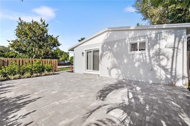 rear view of property featuring a patio area