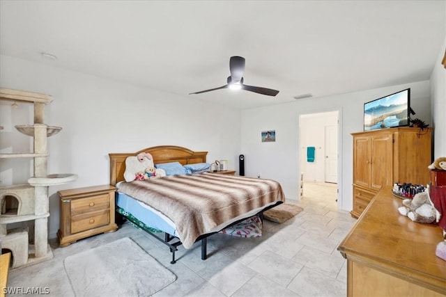 bedroom featuring light tile patterned flooring and ceiling fan