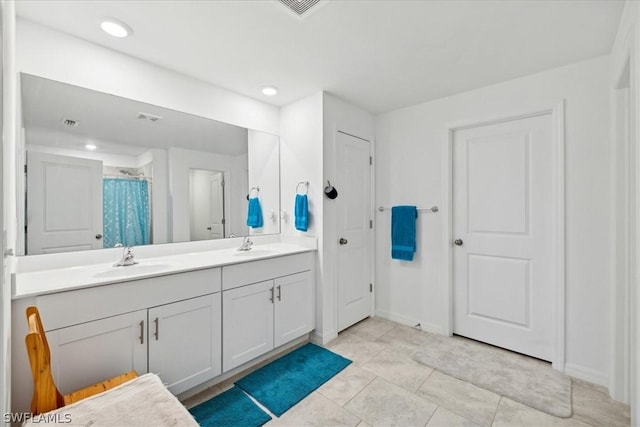 bathroom with tile patterned floors, vanity, and a shower with shower curtain