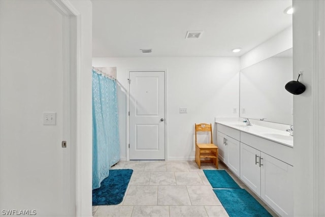 bathroom featuring a shower with shower curtain, vanity, and tile patterned flooring