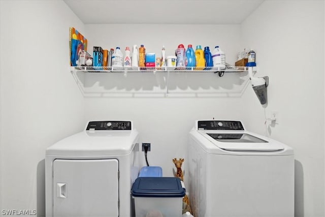 washroom with separate washer and dryer