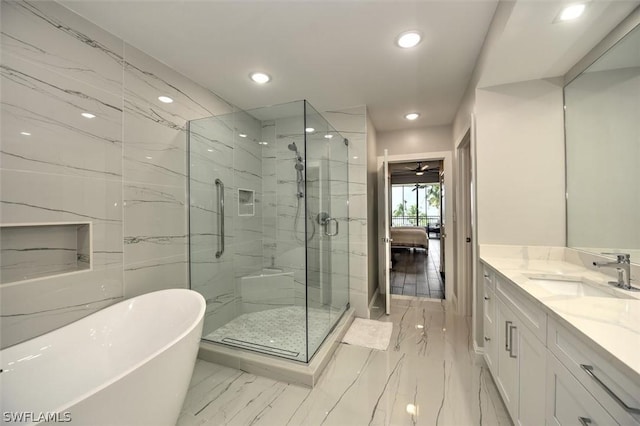 bathroom with vanity, separate shower and tub, and ceiling fan