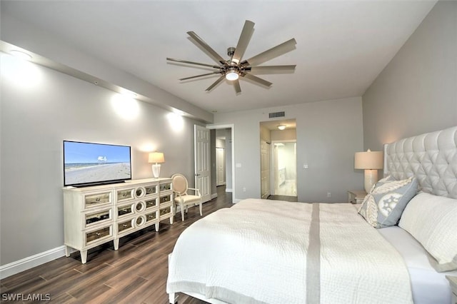 bedroom featuring ensuite bath, ceiling fan, and dark wood-type flooring