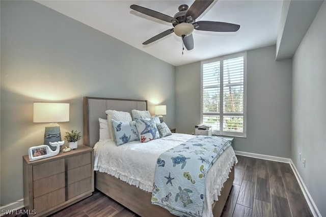 bedroom with ceiling fan and dark hardwood / wood-style floors