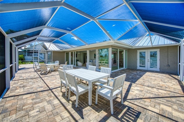 view of patio with french doors and a lanai