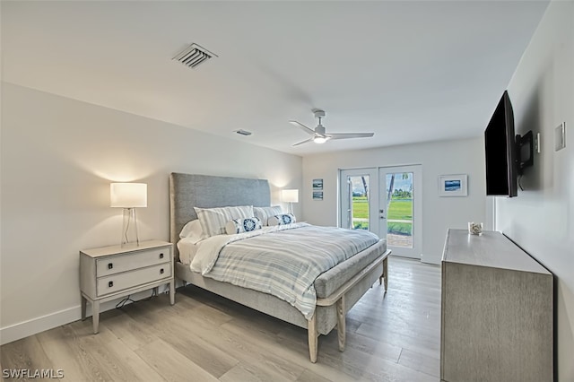 bedroom featuring french doors, access to outside, light hardwood / wood-style flooring, and ceiling fan