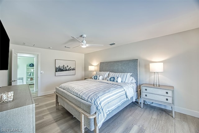 bedroom featuring hardwood / wood-style flooring and ceiling fan