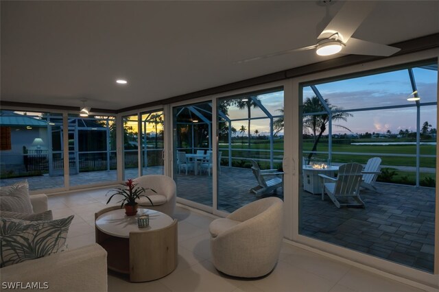 interior space with ceiling fan