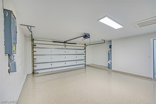 garage featuring electric panel, water heater, and a garage door opener