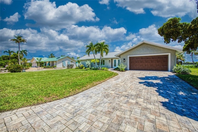 ranch-style home with a front yard and a garage