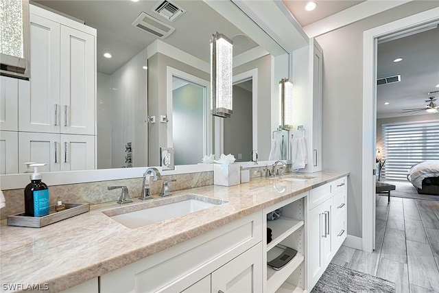 bathroom featuring ceiling fan and vanity