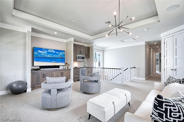 living room with a notable chandelier, light colored carpet, a raised ceiling, and crown molding